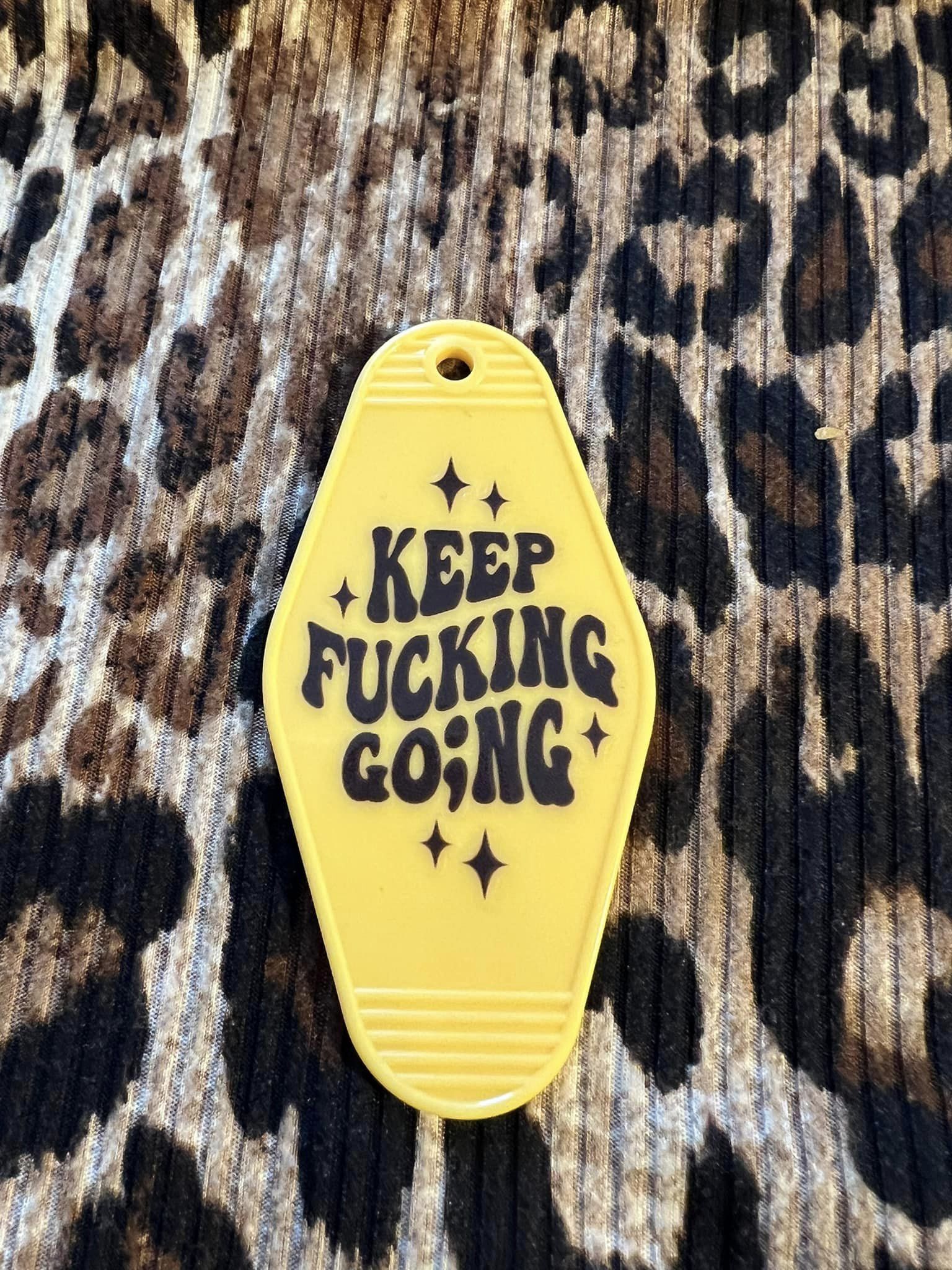 Keep Going Hotel Keychain